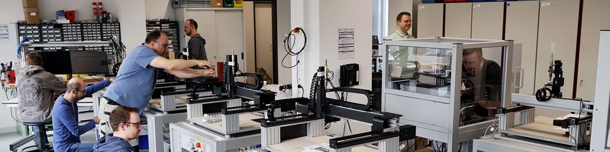 Engineers operating precision microdispensing systems in the microdrop Technologies service laboratory