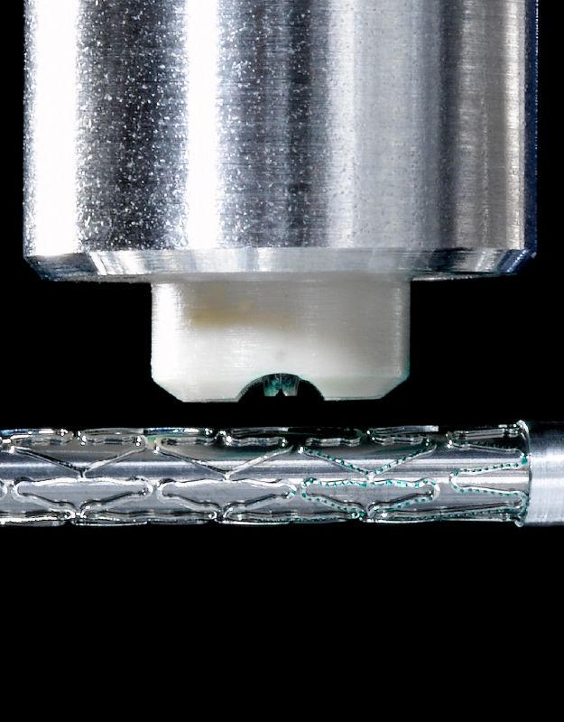 Microdispensing system applying coating to medical components